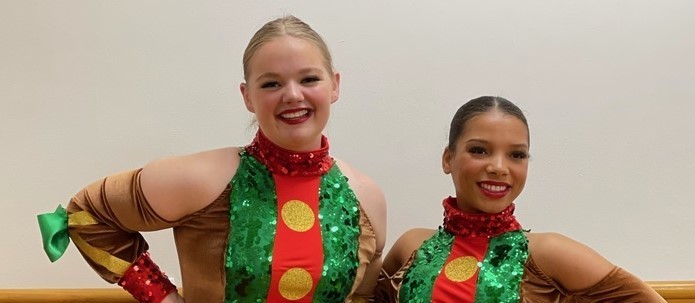 two girls in dance uniforms